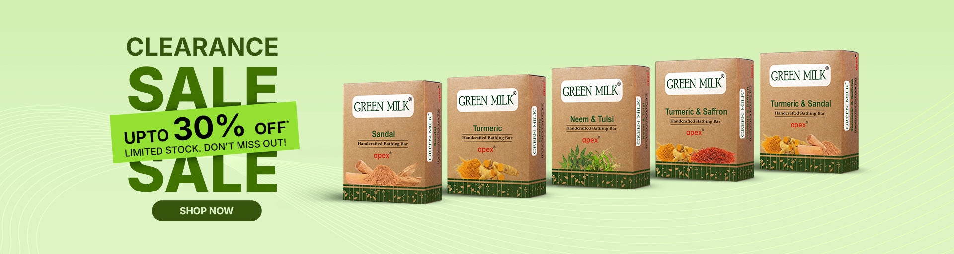 Green Milk product packages with clearance sale text on a green background