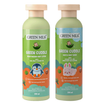 Two bottles of Green Milk Green Cuddle baby products on a white background