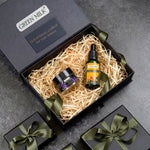Green Milk skincare products in a gift box on a gray surface