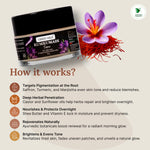 Kumkumadi cream jar with saffron and turmeric flowers on a light background