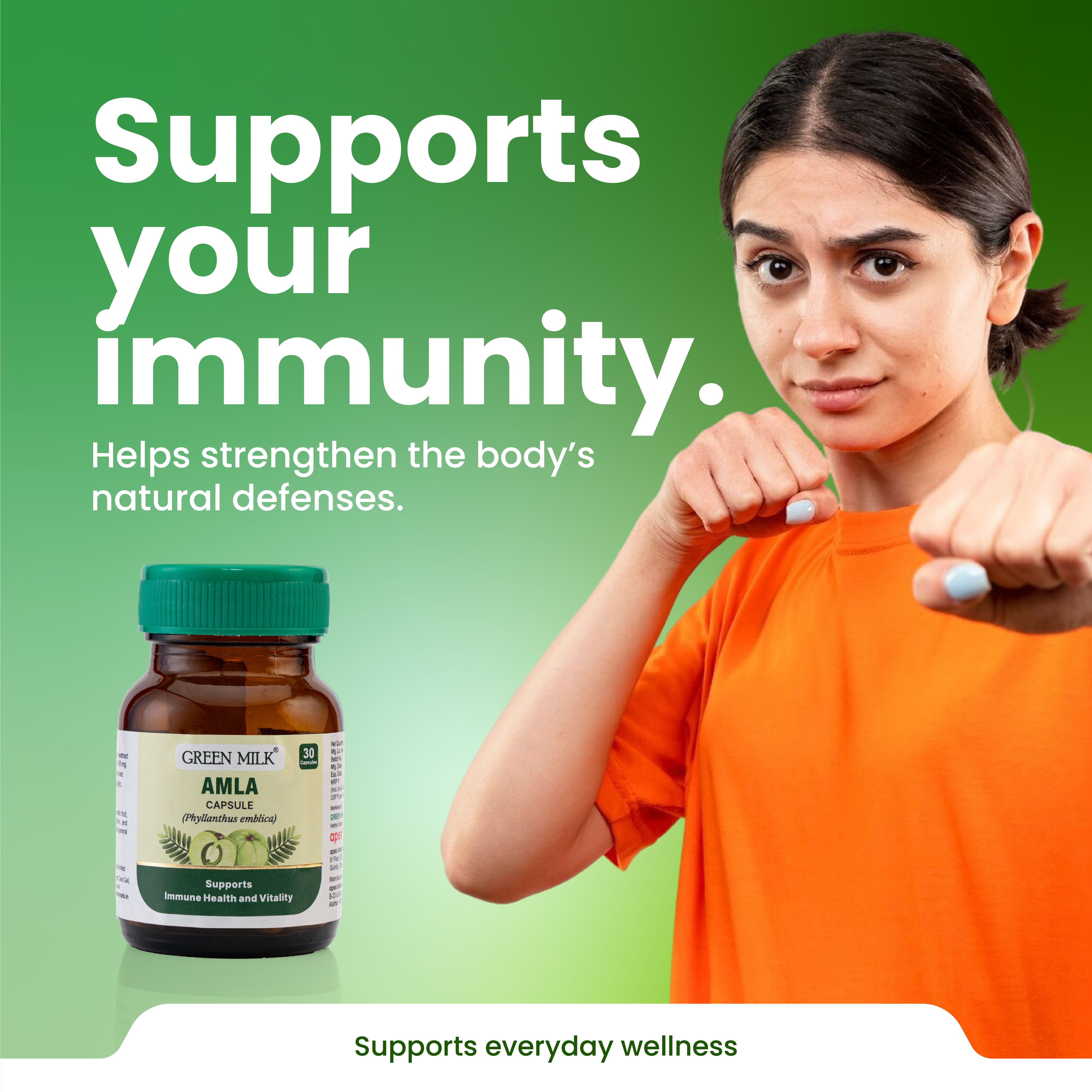 Person in orange shirt with a bottle of Green Milk Amla Capsules on a green background, promoting immunity support.