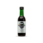 Bottle of Brahmi Lax Hair Oil with a label on a white background