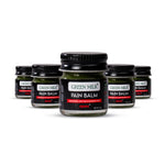 Multiple jars of Green Milk Pain Balm on a white background