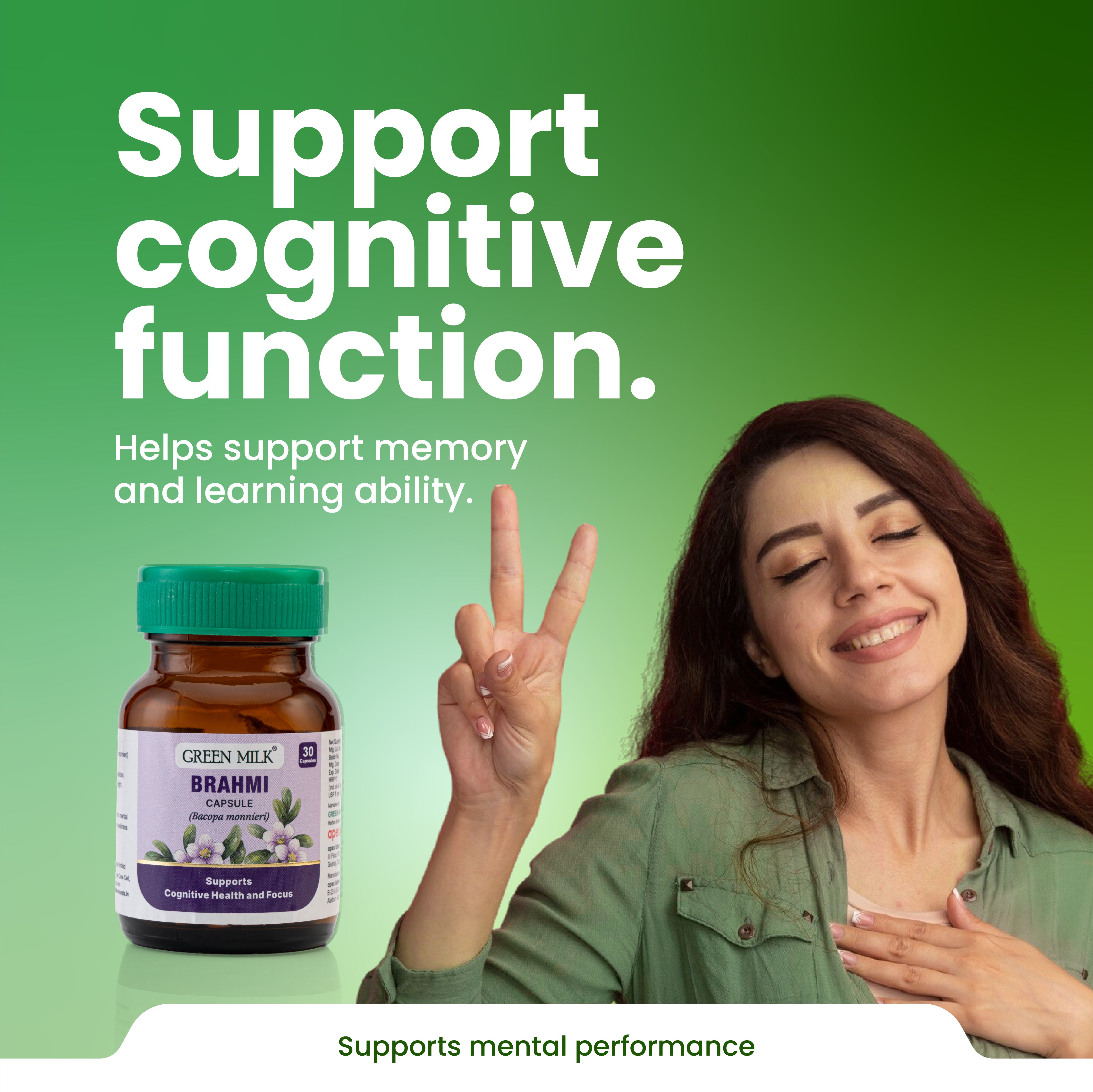 Woman making a peace sign with a bottle of Brahmi capsules on a green background