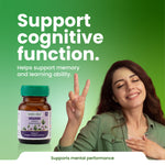 Woman making a peace sign with a bottle of Brahmi capsules on a green background