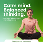 Woman meditating with text 'Calm mind. Balanced thinking.' on a green background