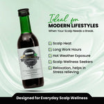 Bottle of hair oil with a label on a light green background, featuring text about scalp care.