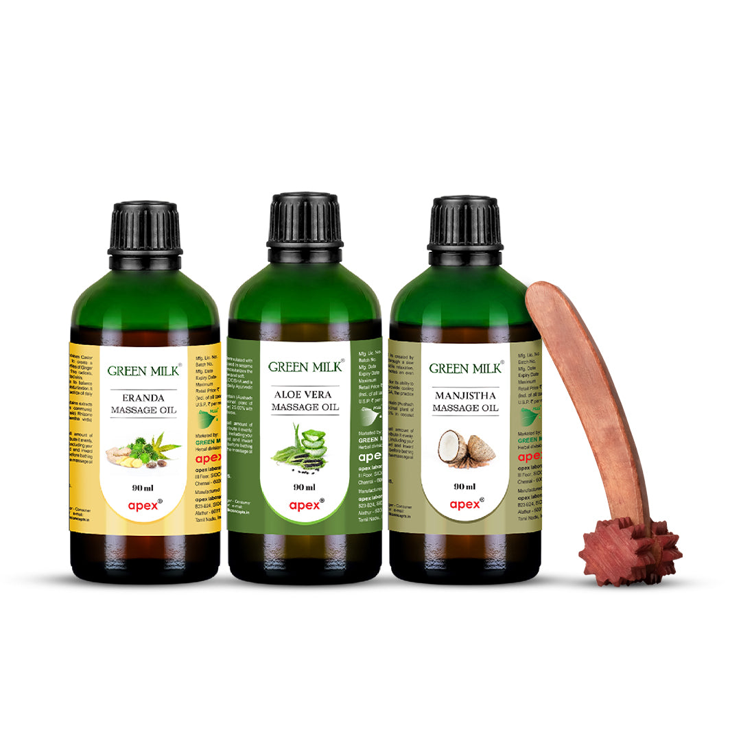 Three bottles of Green Milk massage oil with a wooden roller on a white background