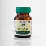 Bottle of Green Milk Amla capsules on a white background