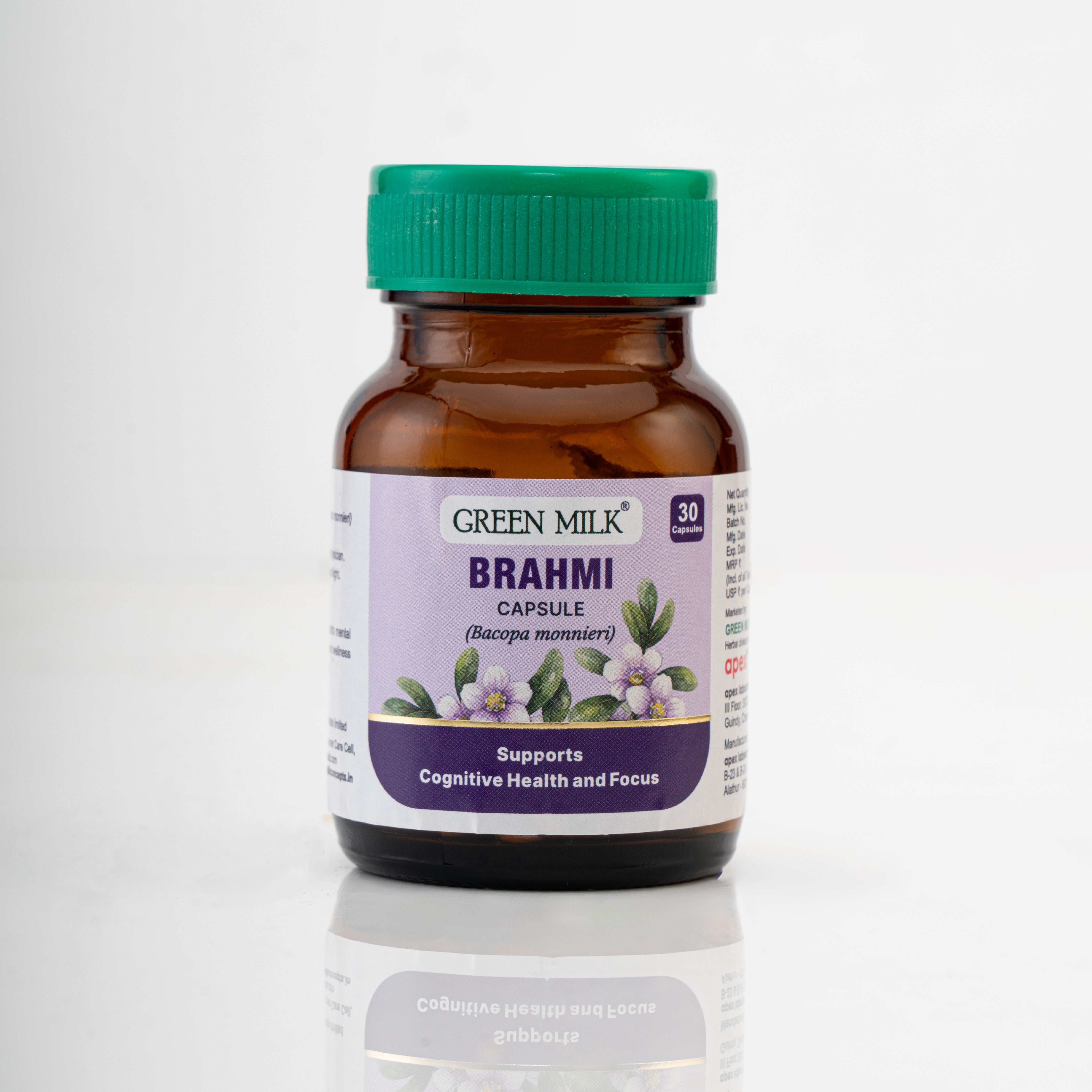 Brown bottle of Green Milk Brahmi capsules with a green cap on a white background