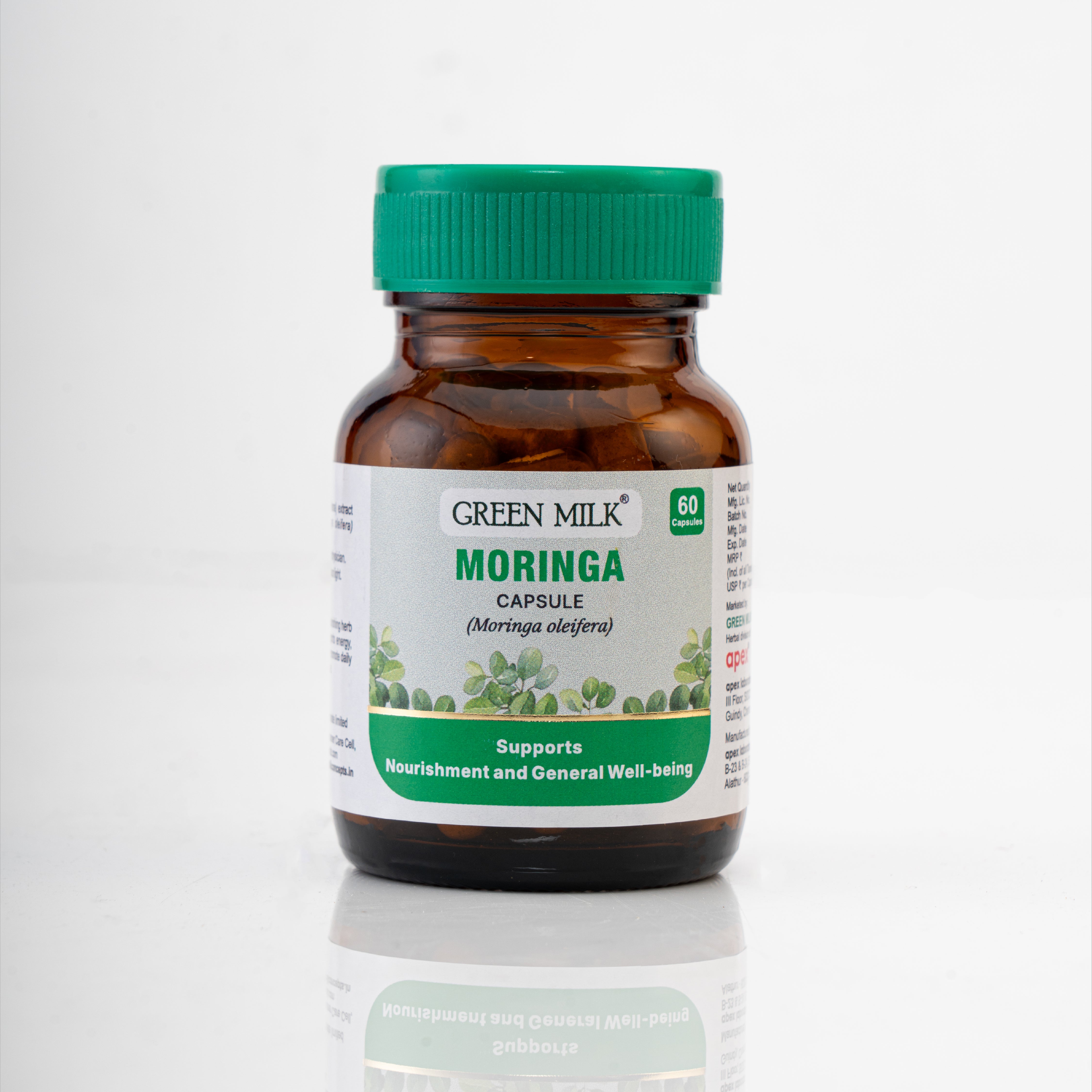 Bottle of Green Milk Moringa capsules on a white background