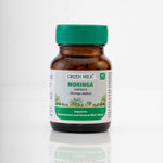 Bottle of Green Milk Moringa capsules on a white background