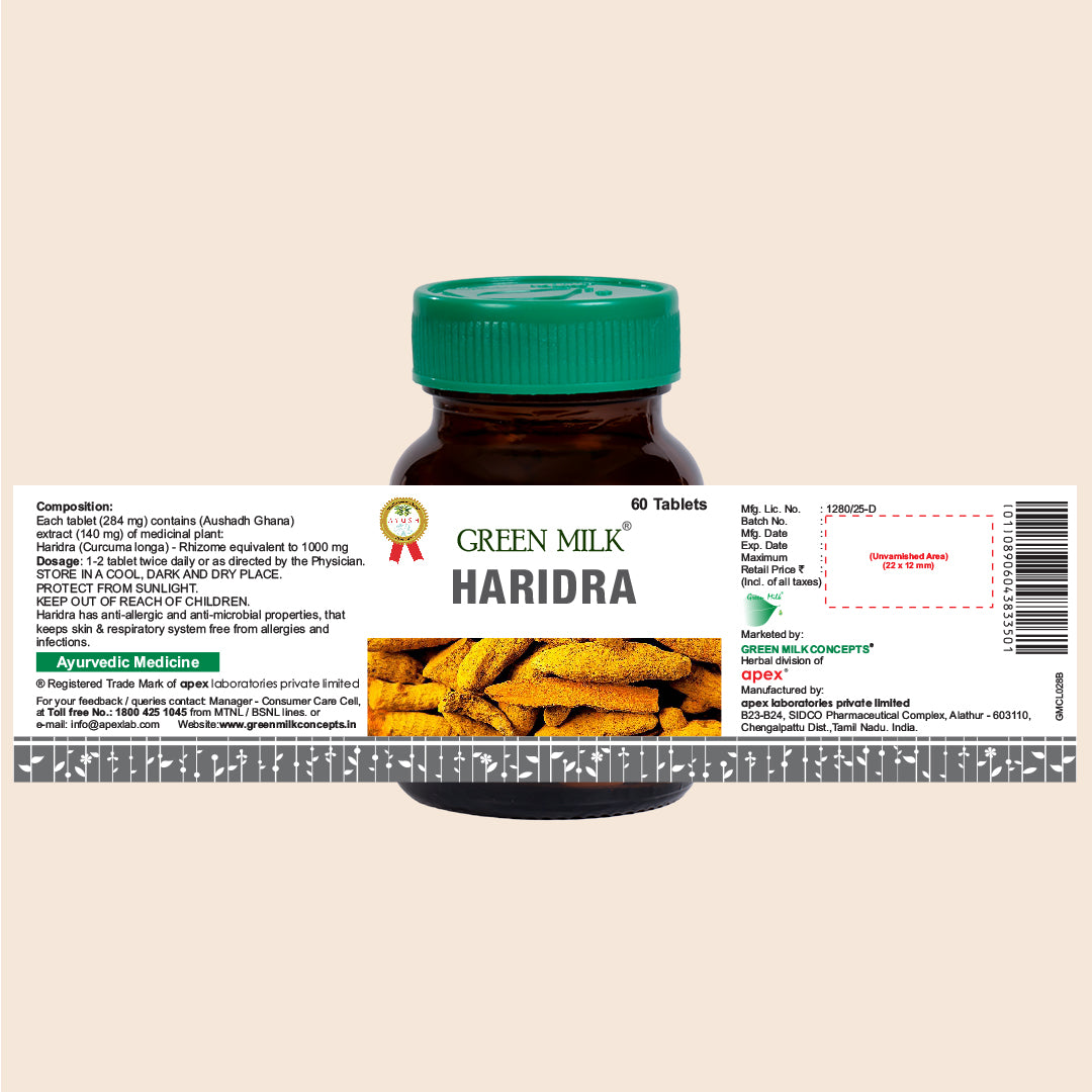 Bottle of Green Milk Haridra with label on a beige background