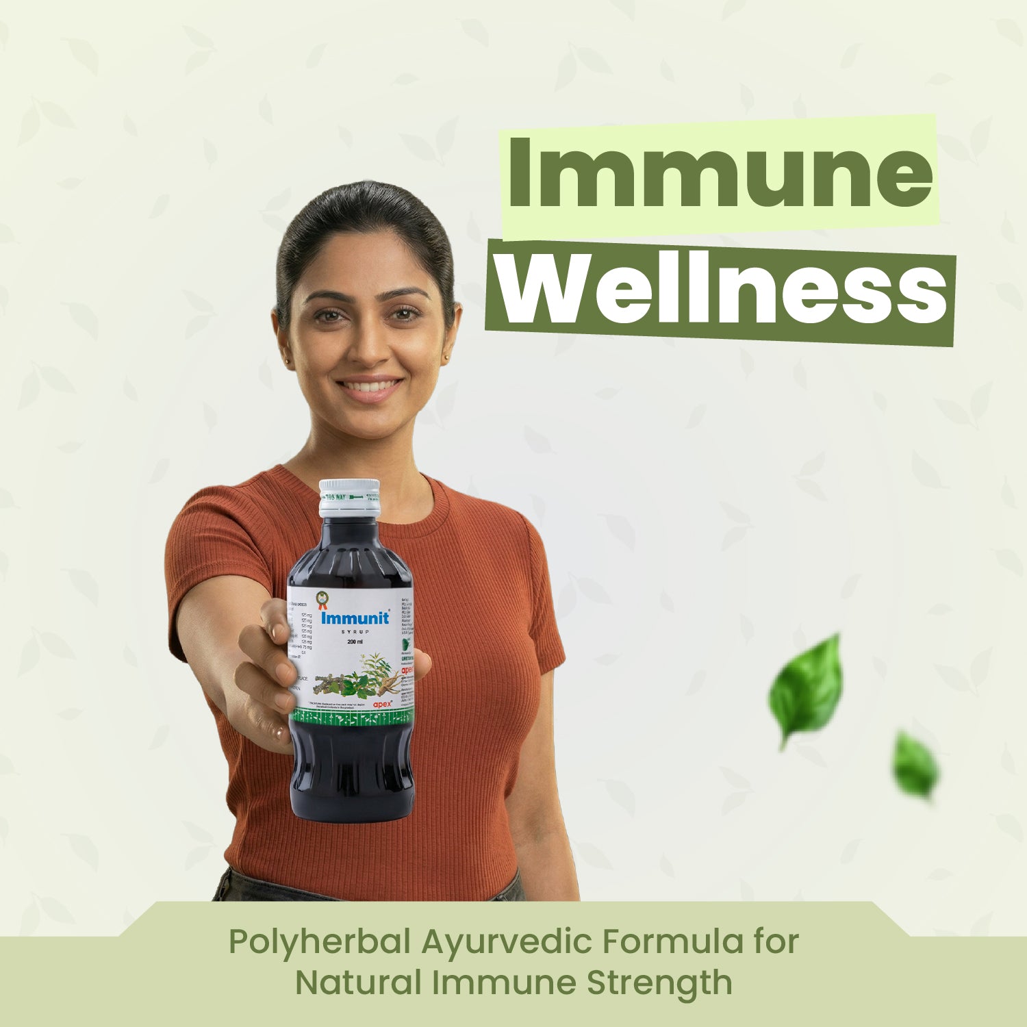 Woman holding a bottle labeled 'Immunite' with 'Immune Wellness' text above on a light green background.