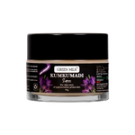 Green Milk Kumkumadi jar with black lid on a white background