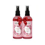 Two bottles of Pannir Rose Face Mist with red bows on a white background