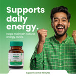 Man in green shirt with raised fists next to a bottle of Green Milk Moringa Capsules on a green background.
