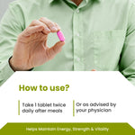 Person holding a pink pill with text on how to use it, against a light green shirt background.