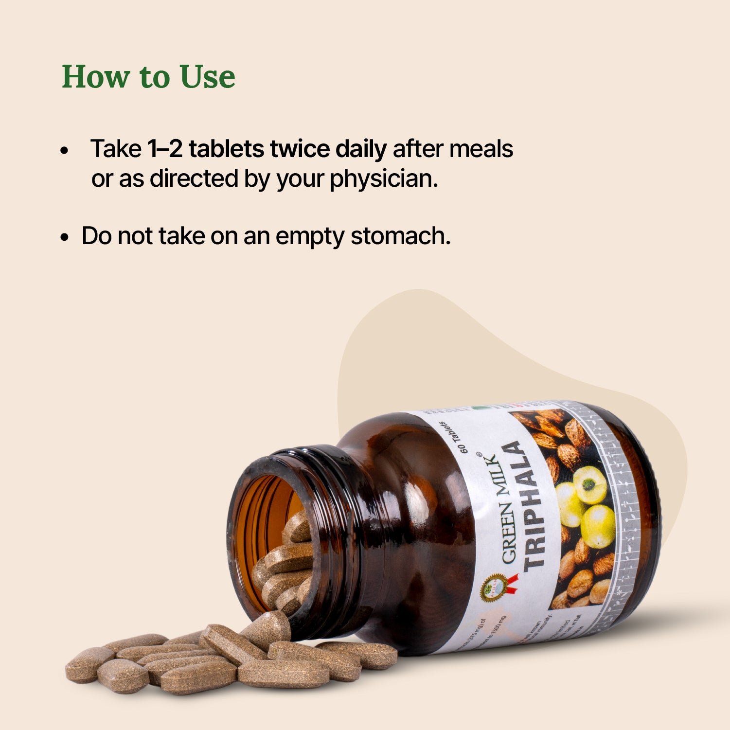 Bottle of Green Milk Triphala with pills spilling out on a beige background