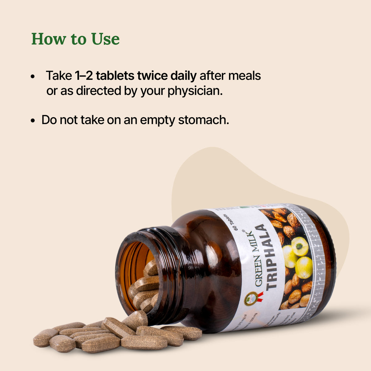 Bottle of Green Milk Triphala with pills spilling out on a beige background