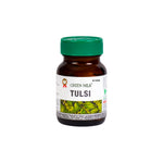 Bottle of Green Milk Tulsi tablets on a white background