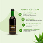 Green Milk hair oil bottle with benefits listed on a light green background